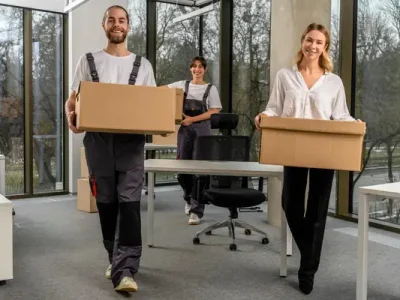 Office clearance service team in Sale removing desks, chairs, and old office equipment