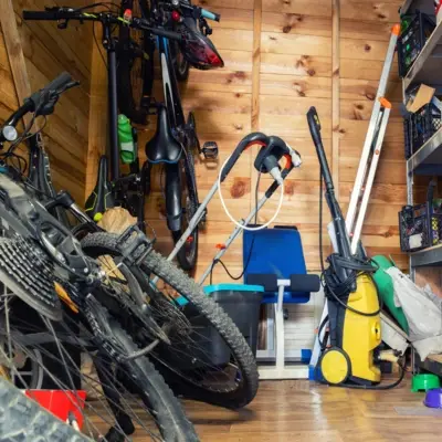 Garage and garden clearance team removing clutter, green waste, and old furniture in Sale